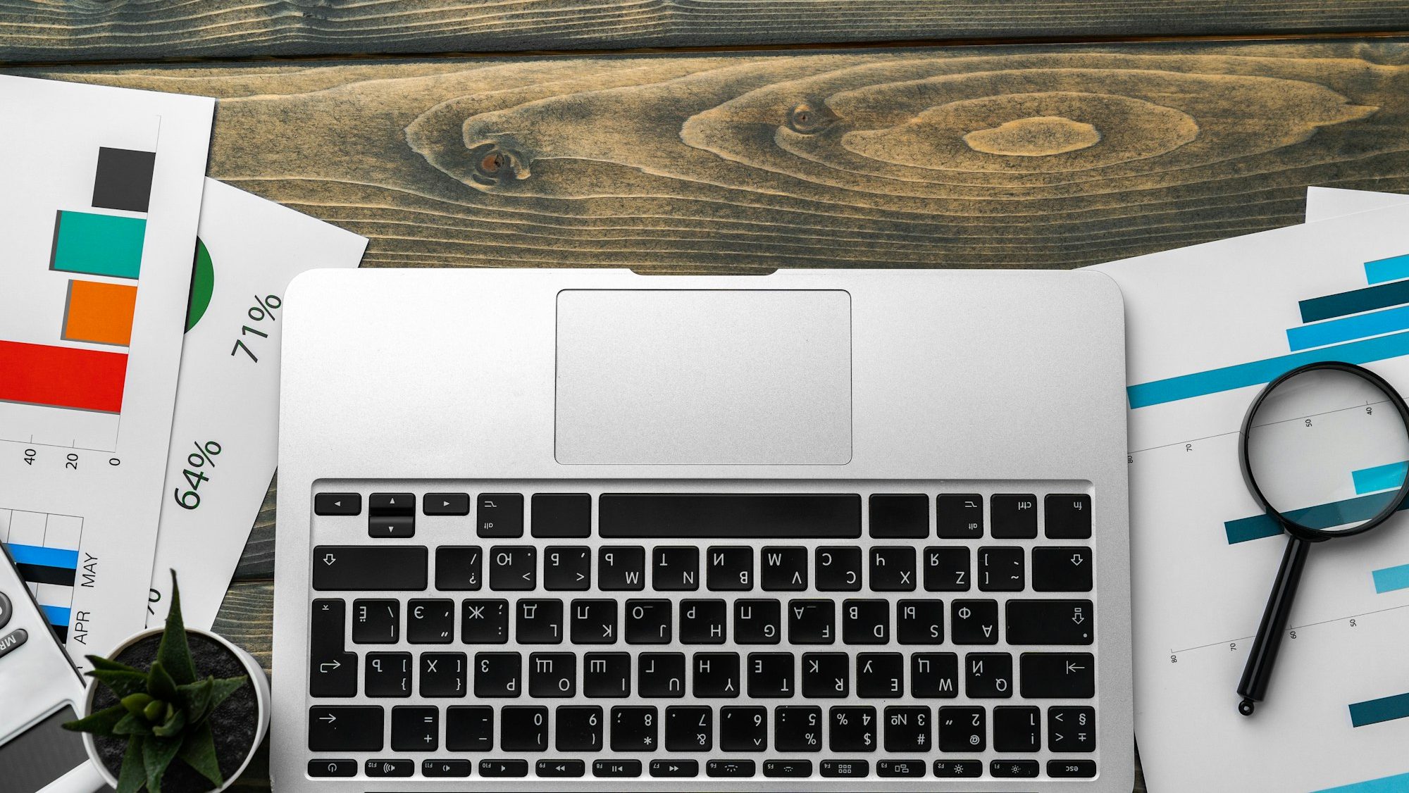 Financial report and laptop on business desk
